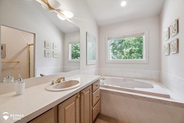 8078 Hawkcrest Dr, Grand Blanc, MI 48439 - full bathroom with vanity, a bath, a shower stall, and vaulted ceiling