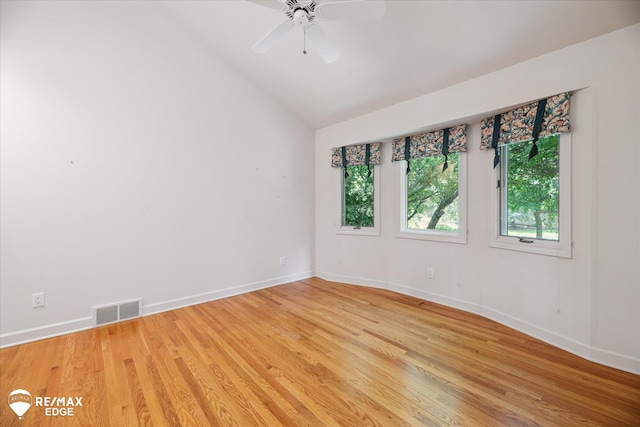 8078 Hawkcrest Dr, Grand Blanc, MI 48439 - unfurnished room with light wood-style floors, vaulted ceiling, and a ceiling fan