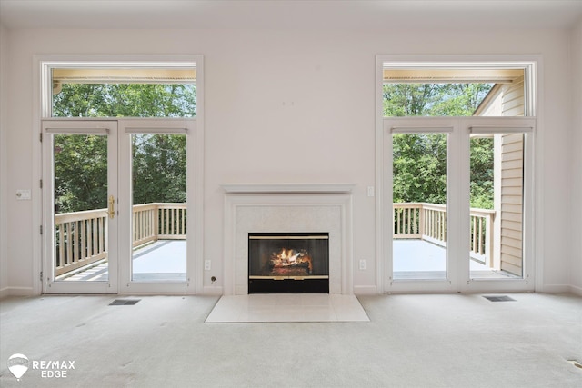 8078 Hawkcrest Dr, Grand Blanc, MI 48439 - unfurnished living room with carpet flooring, plenty of natural light, and a high end fireplace