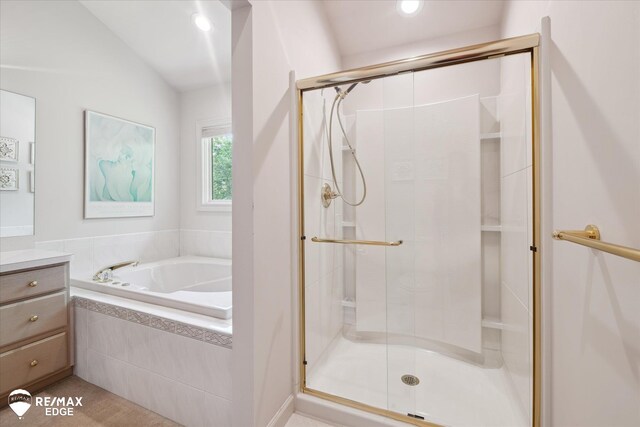 8078 Hawkcrest Dr, Grand Blanc, MI 48439 - full bathroom featuring a bath, a shower stall, vanity, vaulted ceiling, and recessed lighting