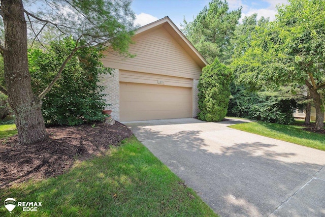 8078 Hawkcrest Dr, Grand Blanc, MI 48439 - view of front of home with concrete driveway and brick siding