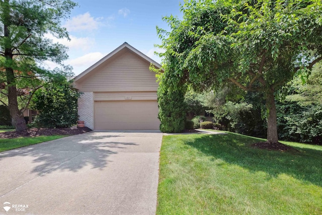 8078 Hawkcrest Dr, Grand Blanc, MI 48439 - view of front facade featuring concrete driveway, a front lawn, an attached garage, and brick siding