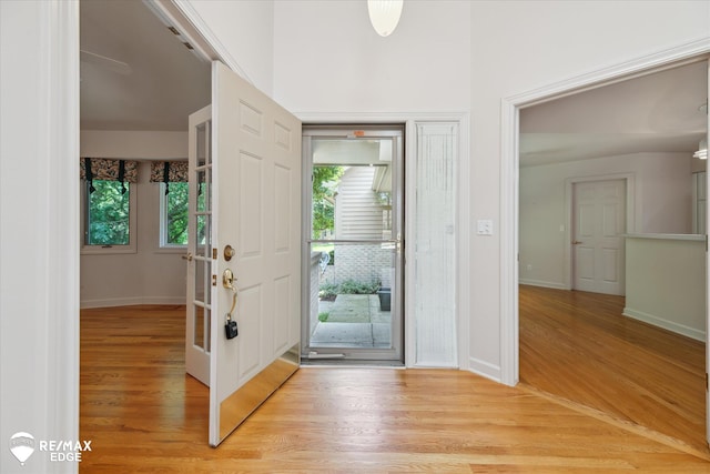 8078 Hawkcrest Dr, Grand Blanc, MI 48439 - entryway with light wood-type flooring and baseboards