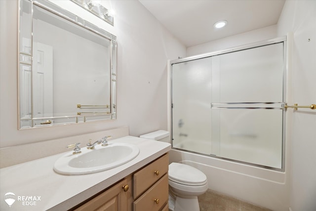 8078 Hawkcrest Dr, Grand Blanc, MI 48439 - bathroom featuring vanity, shower / bath combination with glass door, and recessed lighting