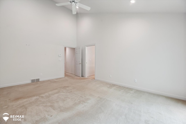 8078 Hawkcrest Dr, Grand Blanc, MI 48439 - spare room with light colored carpet, a towering ceiling, a ceiling fan, and recessed lighting