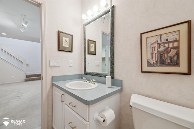8078 Hawkcrest Dr, Grand Blanc, MI 48439 - bathroom featuring vanity and rail lighting