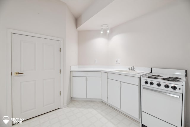 8078 Hawkcrest Dr, Grand Blanc, MI 48439 - kitchen with white electric range, white cabinets, light flooring, and light countertops