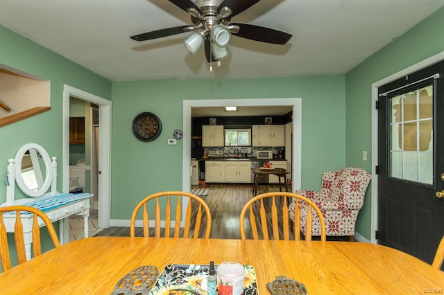 1193 Seneca St, Adrian, MI 49221 - dining room featuring a ceiling fan and wood finished floors