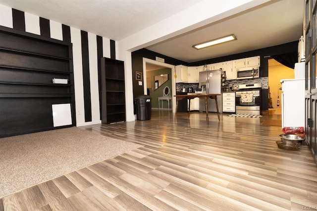 1193 Seneca St, Adrian, MI 49221 - unfurnished living room with light wood-style flooring