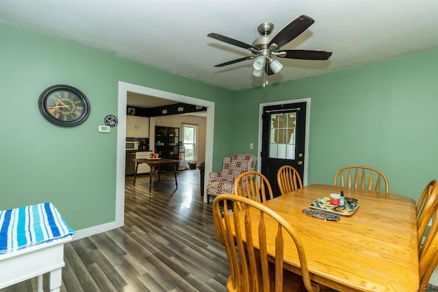 1193 Seneca St, Adrian, MI 49221 - dining area with a ceiling fan and dark wood-style floors