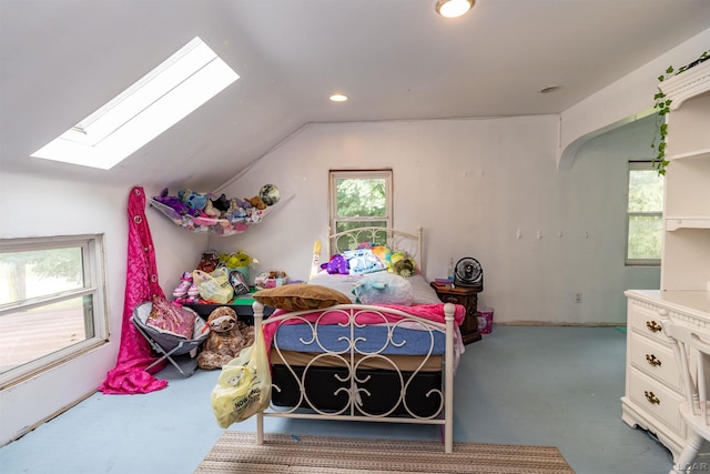 1193 Seneca St, Adrian, MI 49221 - carpeted bedroom with vaulted ceiling, a skylight, and recessed lighting