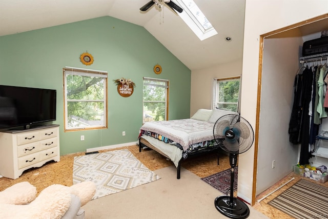 1193 Seneca St, Adrian, MI 49221 - bedroom with a skylight, vaulted ceiling, light colored carpet, a closet, and ceiling fan