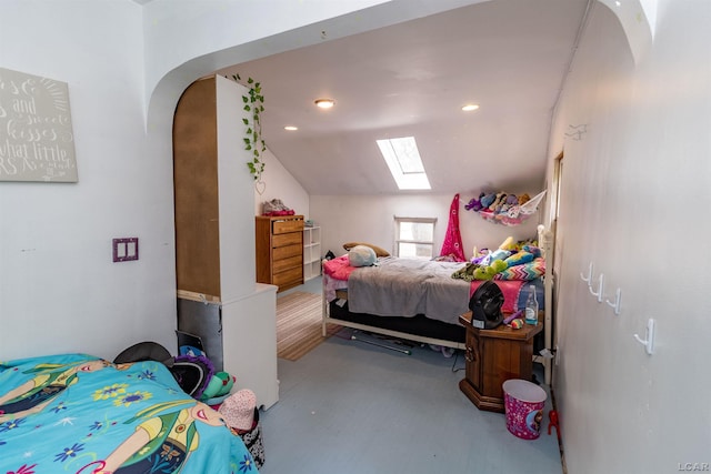 1193 Seneca St, Adrian, MI 49221 - bedroom featuring a skylight, vaulted ceiling, recessed lighting, and arched walkways