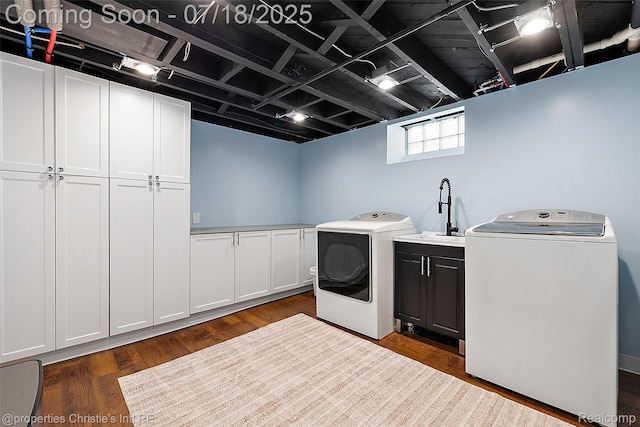 1816 Roslyn Rd, Grosse Pointe Woods, MI 48236 - laundry area featuring cabinet space, washer and clothes dryer, and dark wood-type flooring