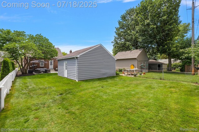 1816 Roslyn Rd, Grosse Pointe Woods, MI 48236 - fenced backyard with an outdoor hangout area and a storage unit