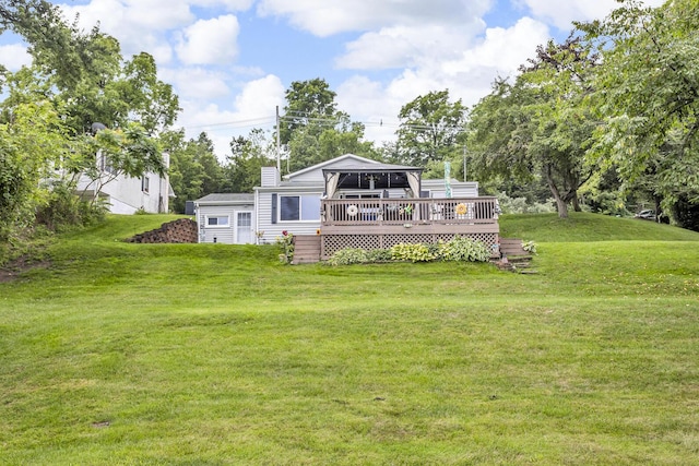 11585 Onsted Hwy, Brooklyn, MI 49230 - back of house with a deck, a lawn, and a chimney