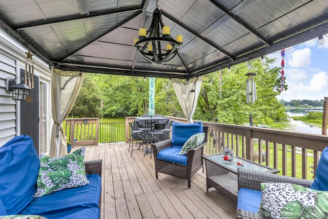 11585 Onsted Hwy, Brooklyn, MI 49230 - wooden terrace with a water view, ceiling fan, outdoor dining space, a grill, and a gazebo
