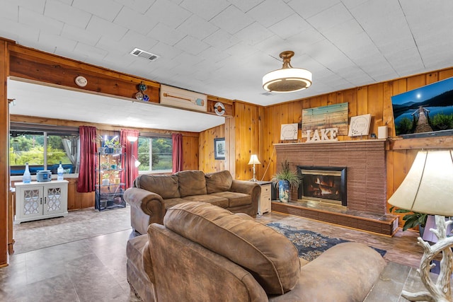 11585 Onsted Hwy, Brooklyn, MI 49230 - living room with wooden walls and a brick fireplace