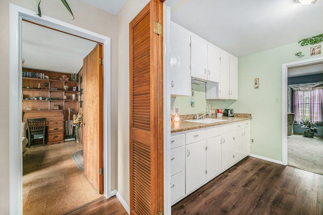 5097 Jackson Rd, Ann Arbor, MI 48103 - kitchen featuring light countertops, white cabinets, and dark wood-style flooring