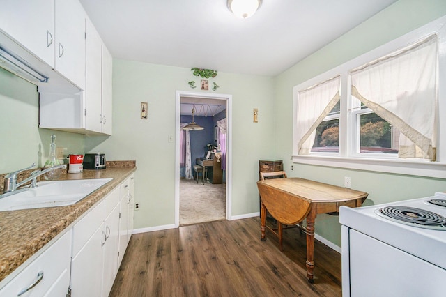 5097 Jackson Rd, Ann Arbor, MI 48103 - kitchen featuring dark wood finished floors, white cabinetry, white range with electric cooktop, and light countertops