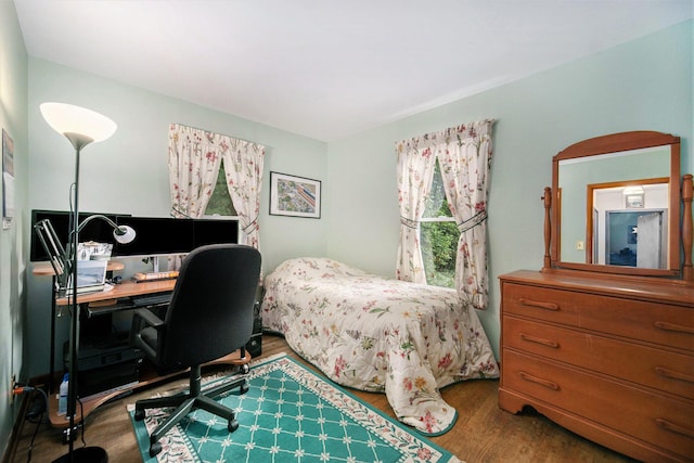 5097 Jackson Rd, Ann Arbor, MI 48103 - bedroom with wood finished floors and an office area