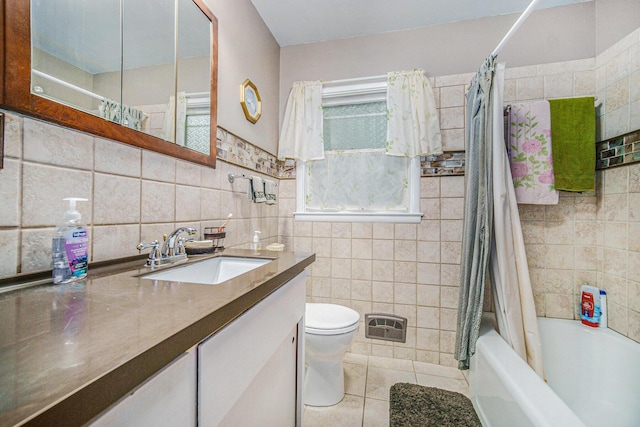 5097 Jackson Rd, Ann Arbor, MI 48103 - bathroom featuring tile walls, tile patterned floors, vanity, and shower / bath combo