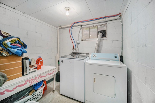 5097 Jackson Rd, Ann Arbor, MI 48103 - laundry room with independent washer and dryer, concrete block wall, and light flooring