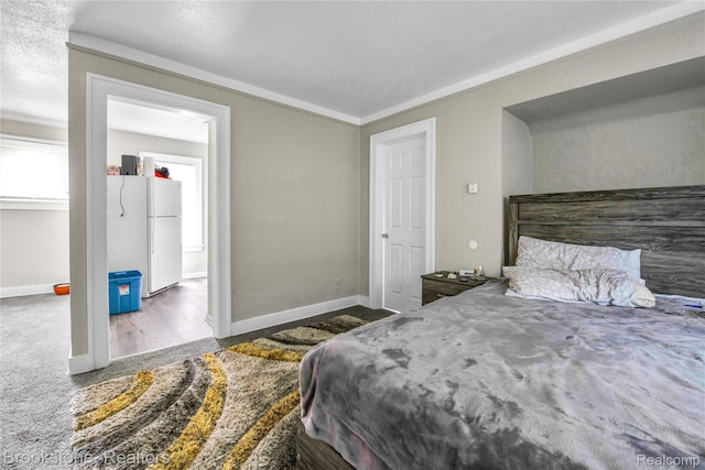 13528 Ardmore St, Detroit, MI 48227 - bedroom with freestanding refrigerator, ornamental molding, and carpet