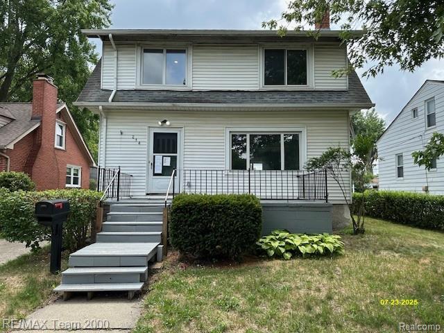 214 E Hazelhurst St, Ferndale, MI 48220 - view of front of property with covered porch and a front lawn