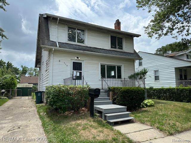214 E Hazelhurst St, Ferndale, MI 48220 - view of front of property with a chimney and roof with shingles
