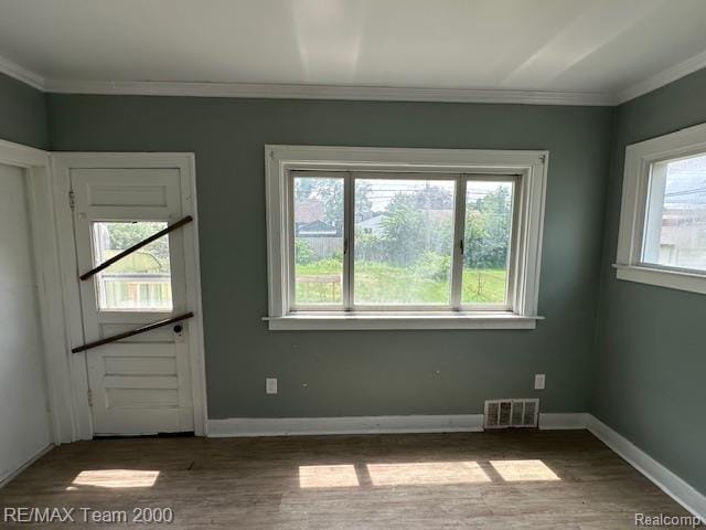 214 E Hazelhurst St, Ferndale, MI 48220 - spare room featuring crown molding and wood finished floors