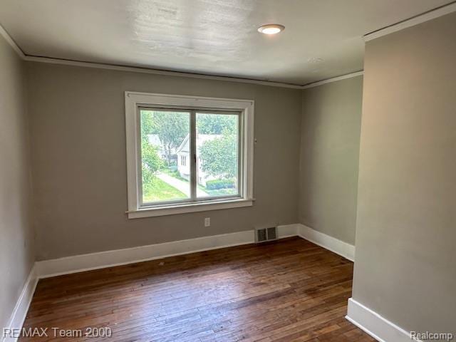 214 E Hazelhurst St, Ferndale, MI 48220 - empty room featuring ornamental molding and dark wood finished floors