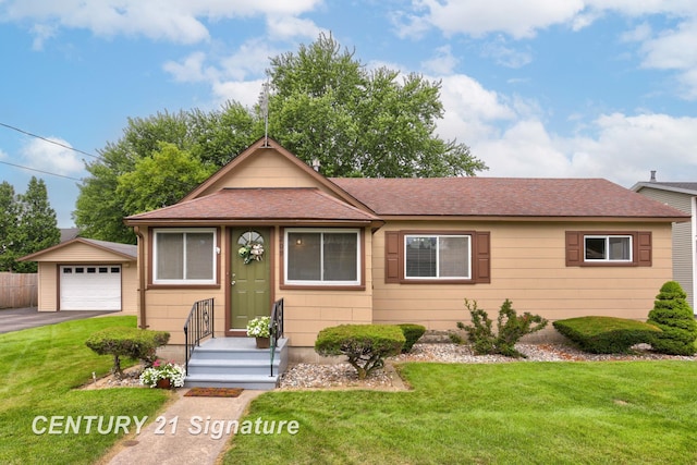 209 3rd St, Linwood, MI 48634 - view of front facade featuring a shingled roof, an outdoor structure, and a front lawn