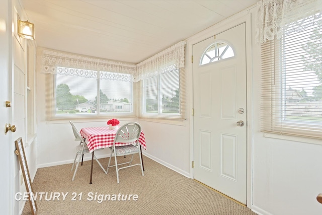 209 3rd St, Linwood, MI 48634 - dining room with plenty of natural light and carpet