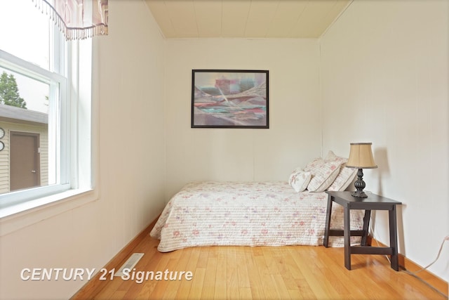 209 3rd St, Linwood, MI 48634 - bedroom with wood finished floors and baseboards