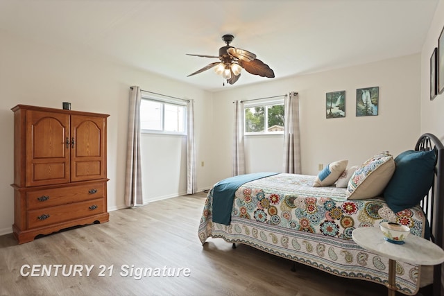 209 3rd St, Linwood, MI 48634 - bedroom featuring light wood finished floors and a ceiling fan