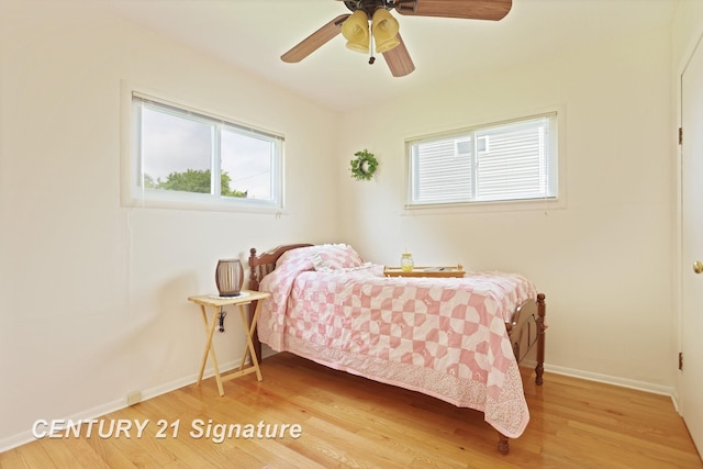209 3rd St, Linwood, MI 48634 - bedroom featuring wood finished floors and a ceiling fan