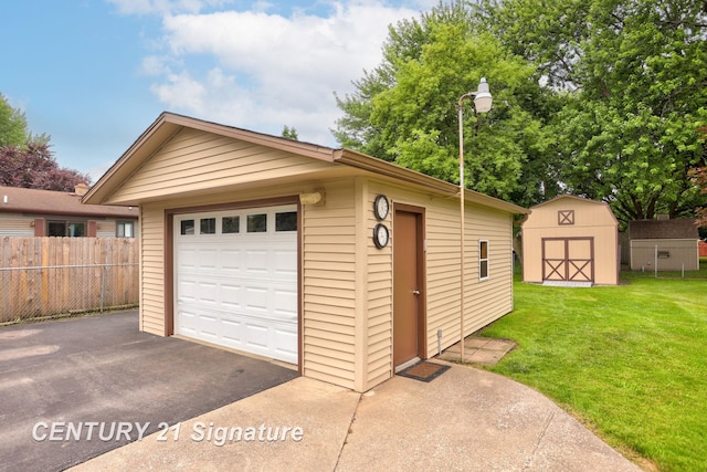 209 3rd St, Linwood, MI 48634 - detached garage featuring asphalt driveway