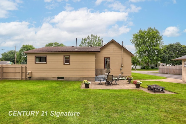 209 3rd St, Linwood, MI 48634 - rear view of house featuring a fire pit and a patio area