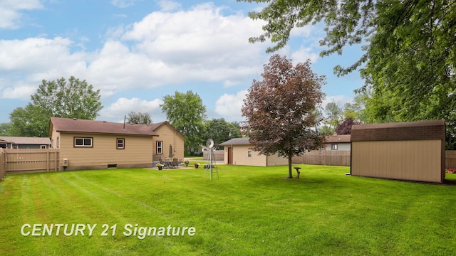 209 3rd St, Linwood, MI 48634 - fenced backyard featuring a storage shed
