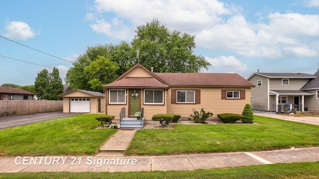 209 3rd St, Linwood, MI 48634 - view of front of house with driveway, a garage, an outdoor structure, and roof with shingles