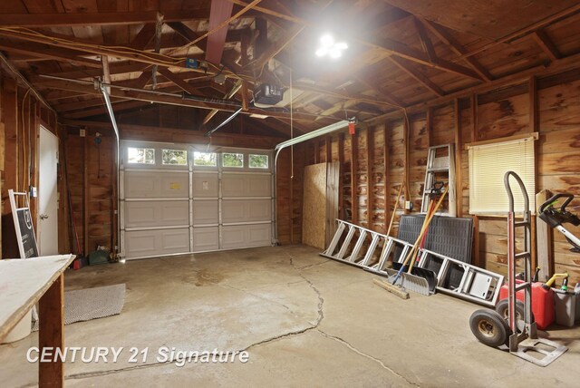 209 3rd St, Linwood, MI 48634 - garage featuring a garage door opener