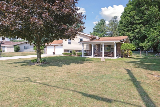 10999 M 140, Niles, MI 49120 - view of front of house with a porch, driveway, a garage, and brick siding