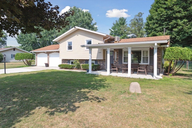 10999 M 140, Niles, MI 49120 - tri-level home with driveway, a porch, a front lawn, a garage, and brick siding