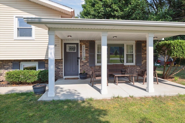 10999 M 140, Niles, MI 49120 - property entrance with covered porch, a lawn, and brick siding