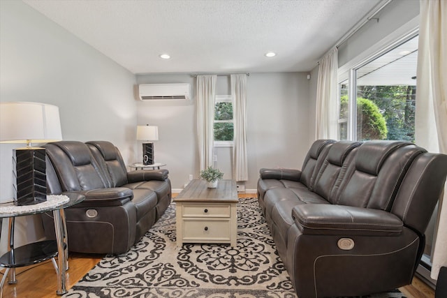 10999 M 140, Niles, MI 49120 - living area with wood finished floors, a textured ceiling, recessed lighting, and a wall mounted air conditioner