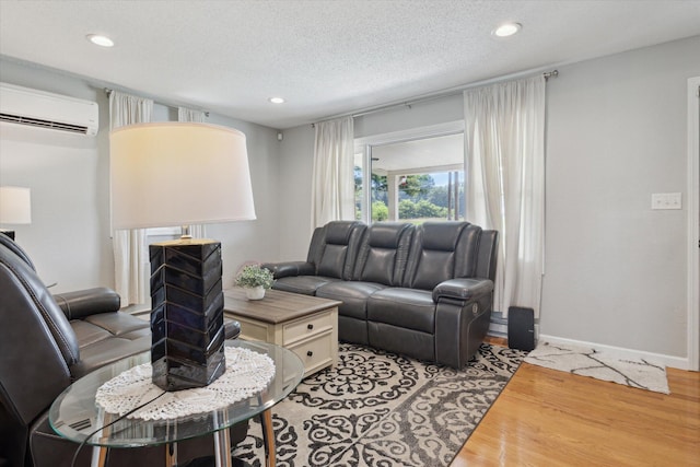 10999 M 140, Niles, MI 49120 - living room featuring wood finished floors, an AC wall unit, recessed lighting, and a textured ceiling