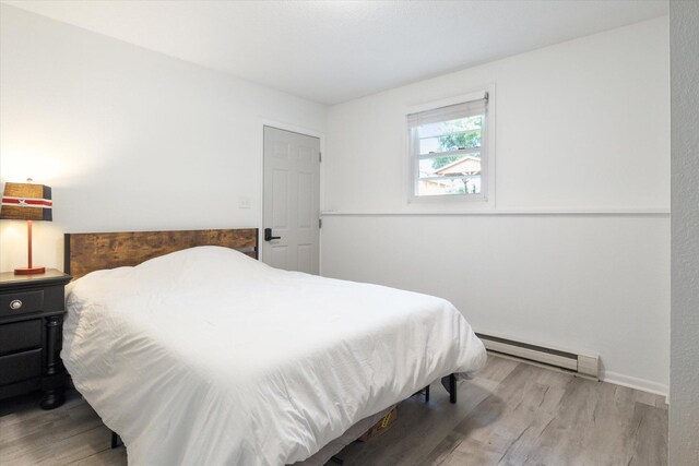 10999 M 140, Niles, MI 49120 - bedroom with a baseboard heating unit and wood finished floors
