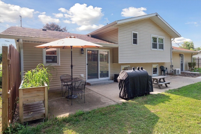10999 M 140, Niles, MI 49120 - back of house with a patio area, a lawn, and roof with shingles