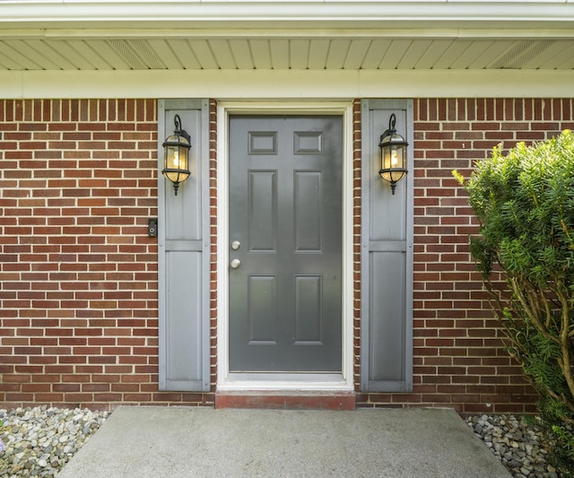 700 Devonshire Rd, Fowlerville, MI 48836 - property entrance with brick siding